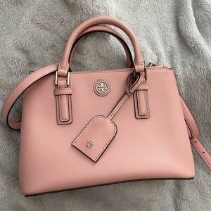 Pastel Pink TORY BURCH double zipper bag with shoulder strap & feet beneath bag